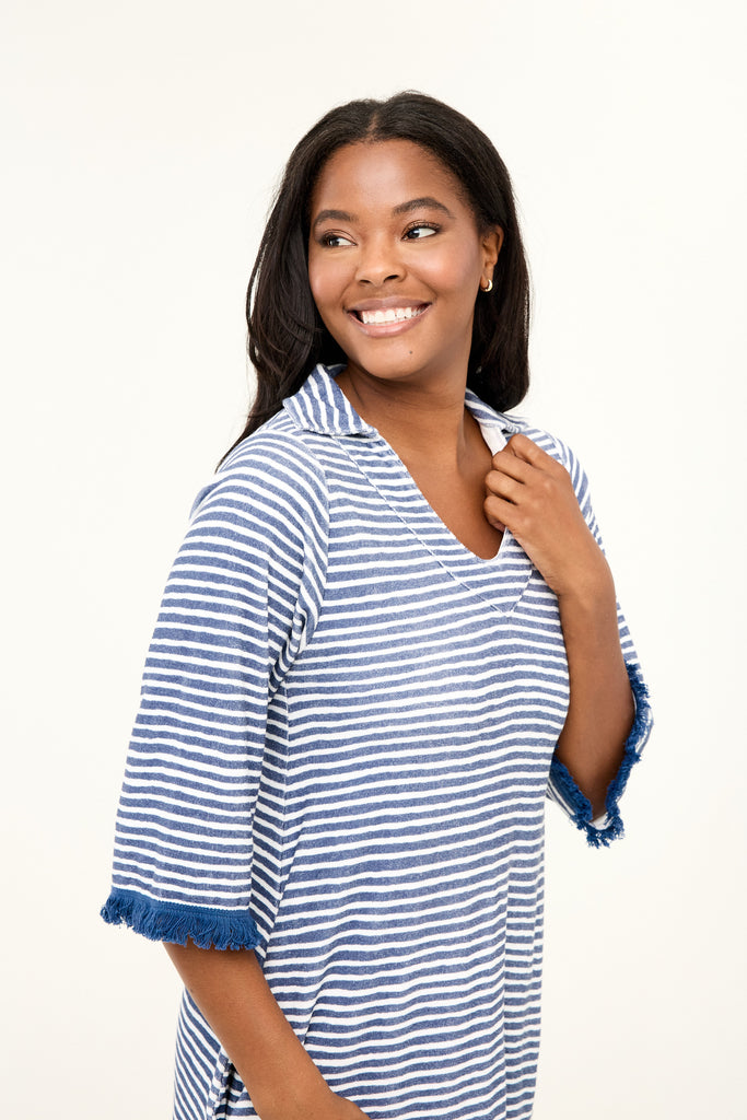 Woman wearing a blue and white striped shirt on a white background