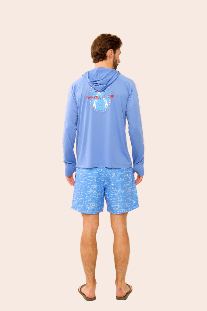 Man wearing a blue hoodie and shorts on a beige background